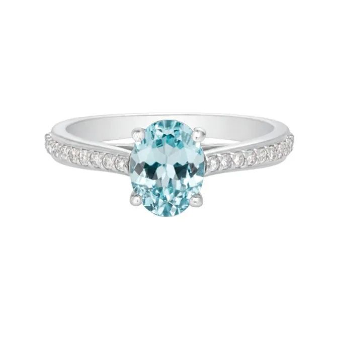 Anillo de oro blanco con diamantes 0,17 quilates y topacio azul