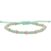 Pulsera de oro rosa y macramé verde menta