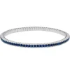 Pulsera riviere elástica de oro blanco y zafiros azules