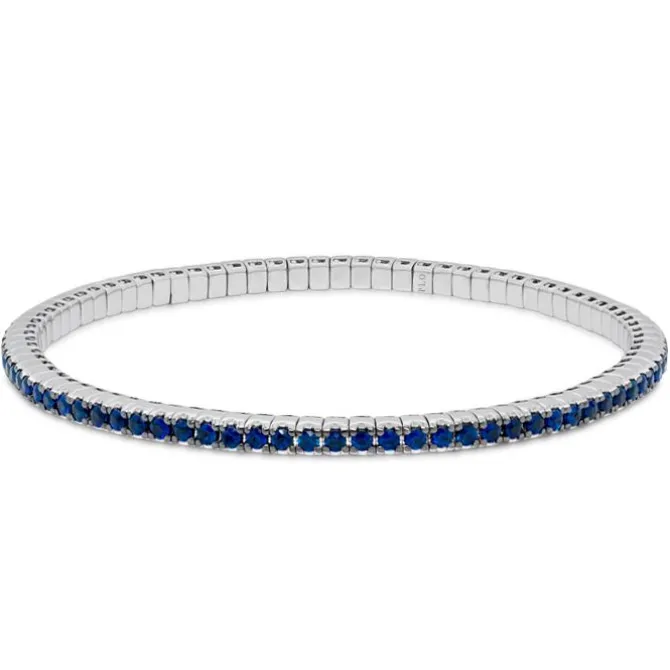 Pulsera riviere elástica de oro blanco y zafiros azules